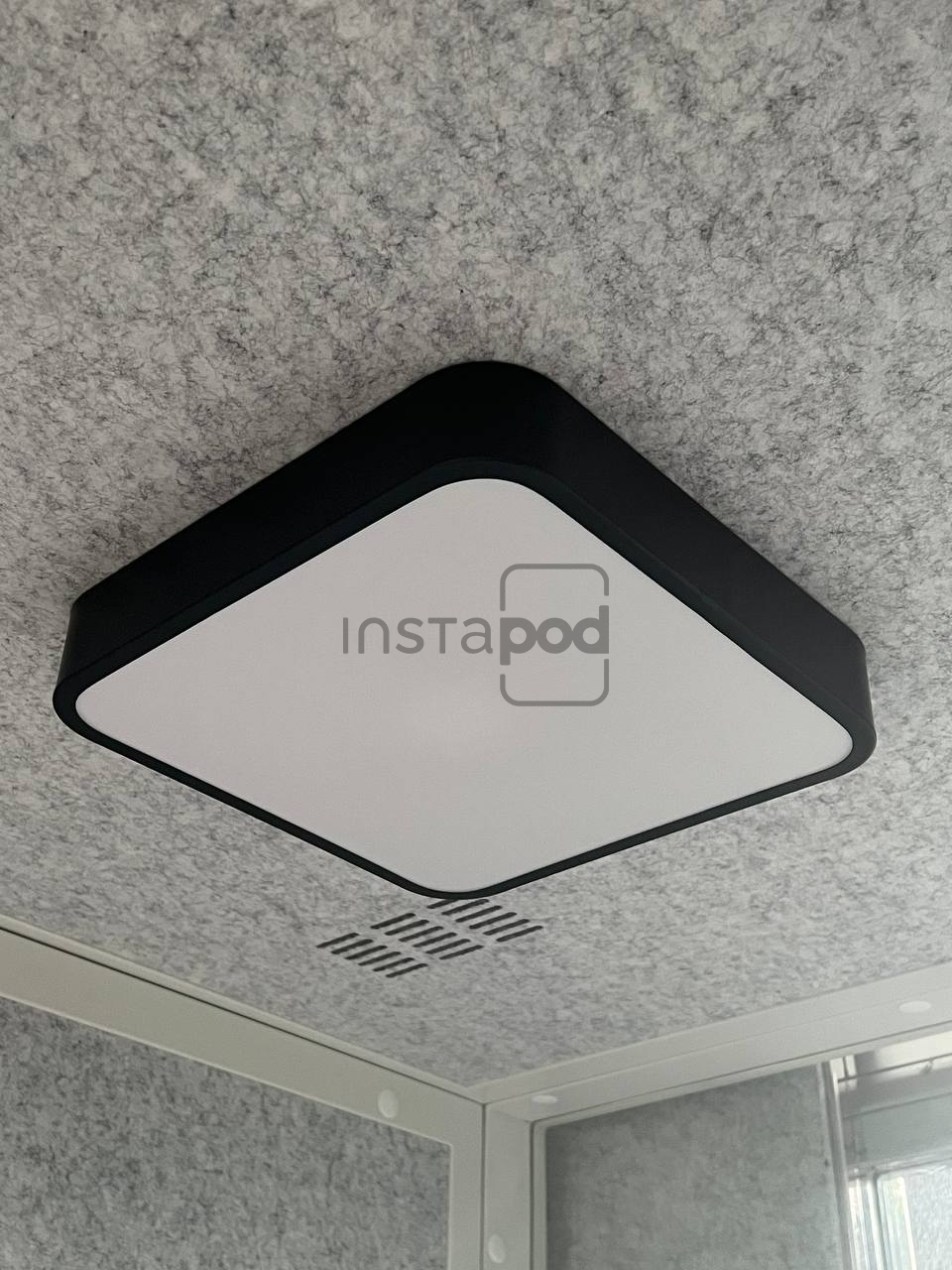 instapods-indoor-office-booth-features-ceiling-lamp-numero