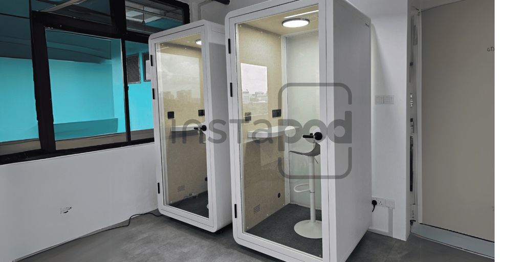 Two soundproof booths with bright interiors and minimalist design.