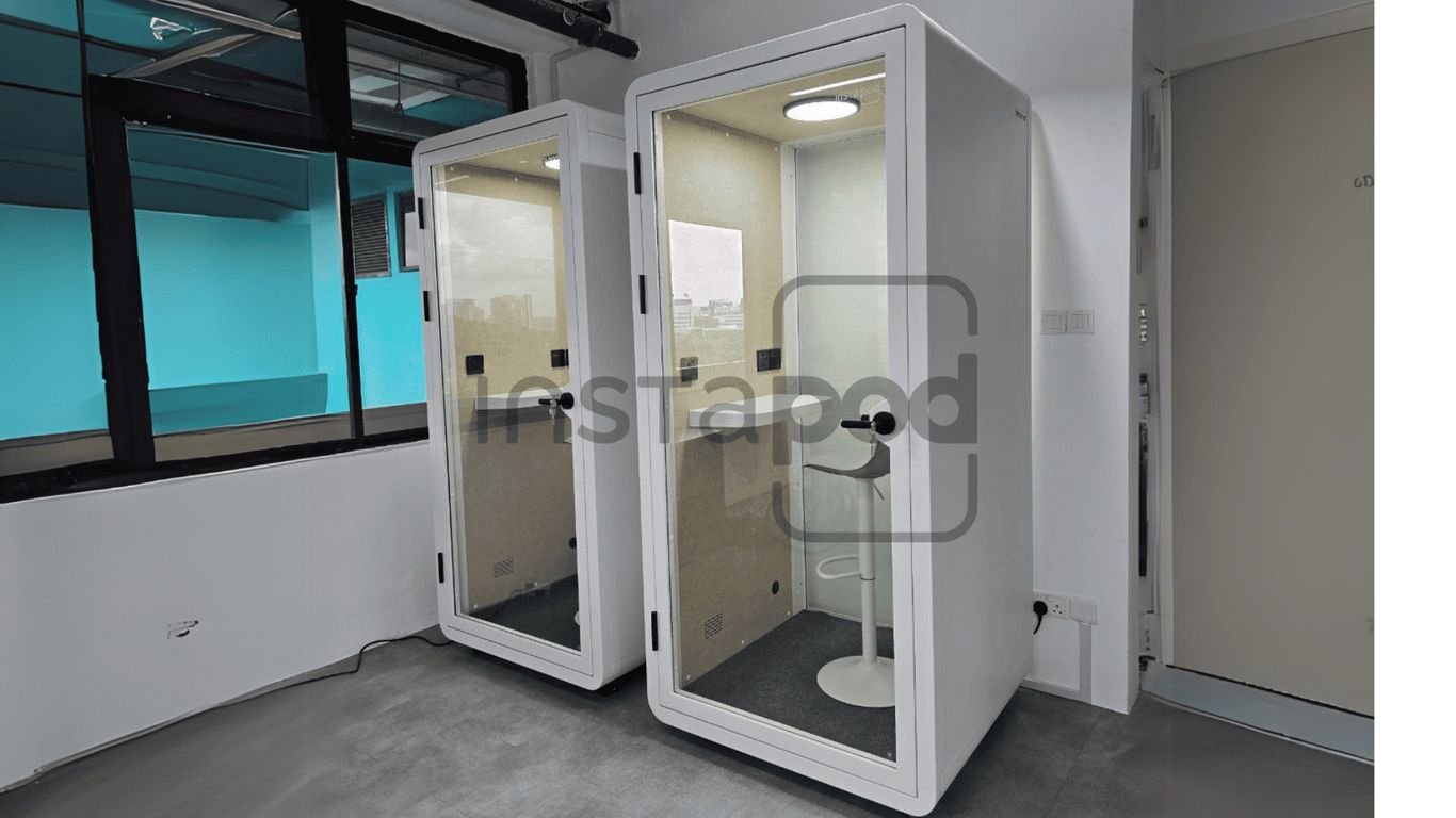 Two soundproof booths with bright interiors and minimalist design.
