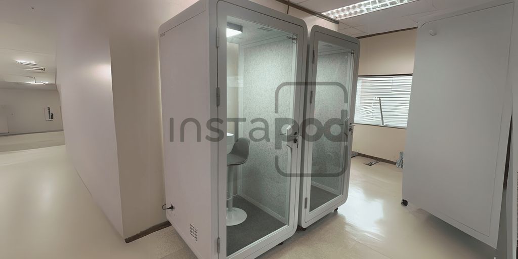 Two soundproof booths with seating, branded "Instapod."