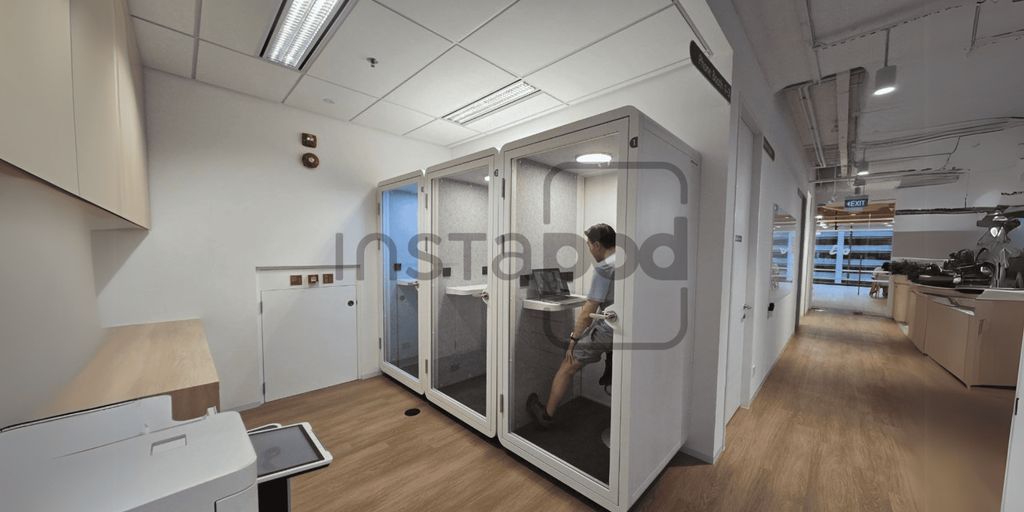 Office space with soundproof booths for private work sessions.