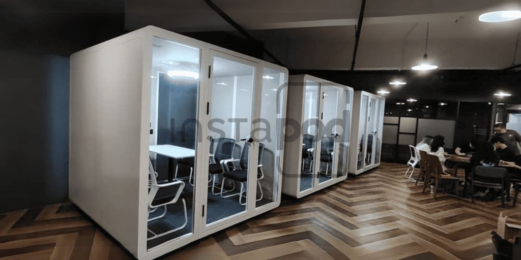 Modern office space with quiet meeting pods and collaborative areas.