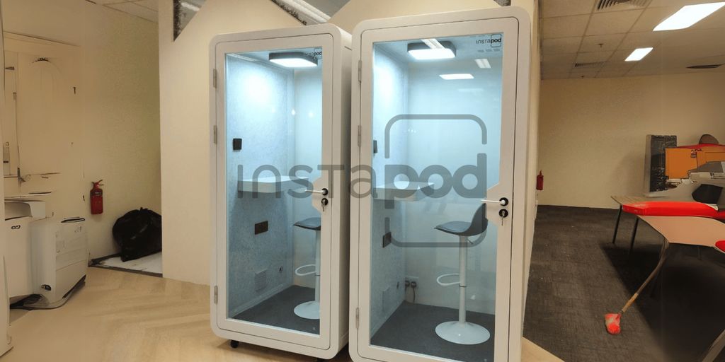 Two soundproof booths in an office-like environment.