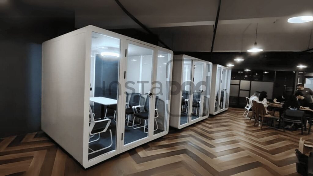 Modern office space with quiet meeting pods and collaborative areas.