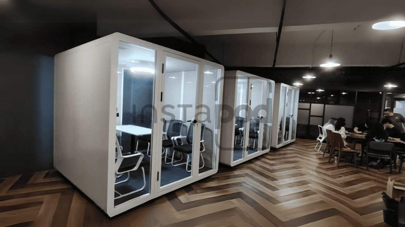 Modern office space with quiet meeting pods and collaborative areas.