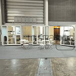 A modern office space with individual work pods and seating.