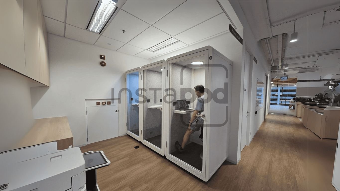 Office space with soundproof booths for private work sessions.