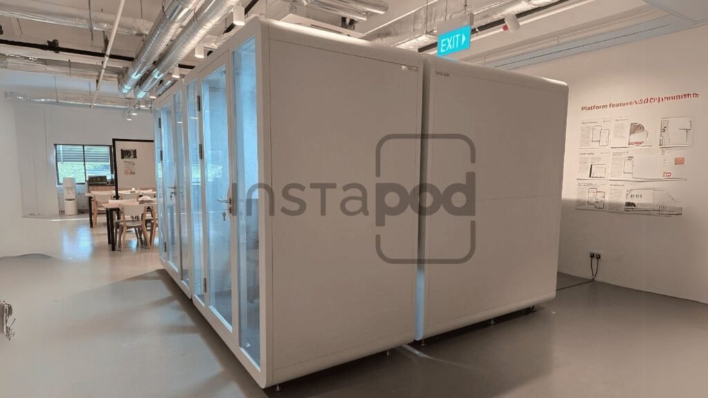 Modern office space featuring modular white work pods.