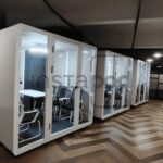 Modern office space with quiet meeting pods and collaborative areas.