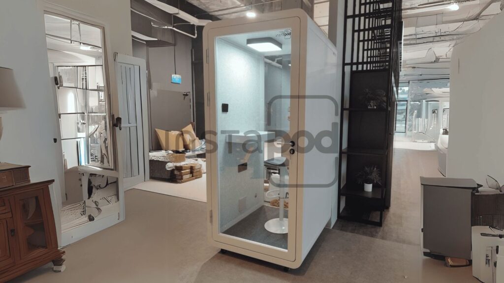 Modern soundproof pod in a stylish office environment.