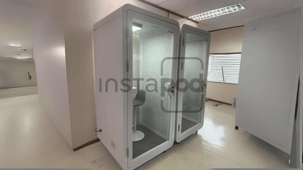 Two soundproof booths with seating, branded "Instapod."