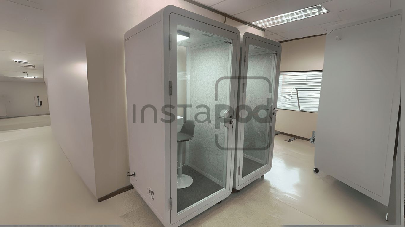 Two soundproof booths with seating, branded "Instapod."