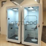 Two soundproof booths in an office-like environment.