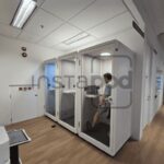 Office space with soundproof booths for private work sessions.