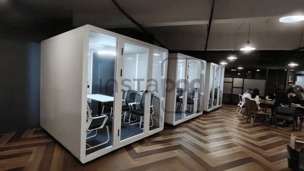 Modern office space with quiet meeting pods and collaborative areas.